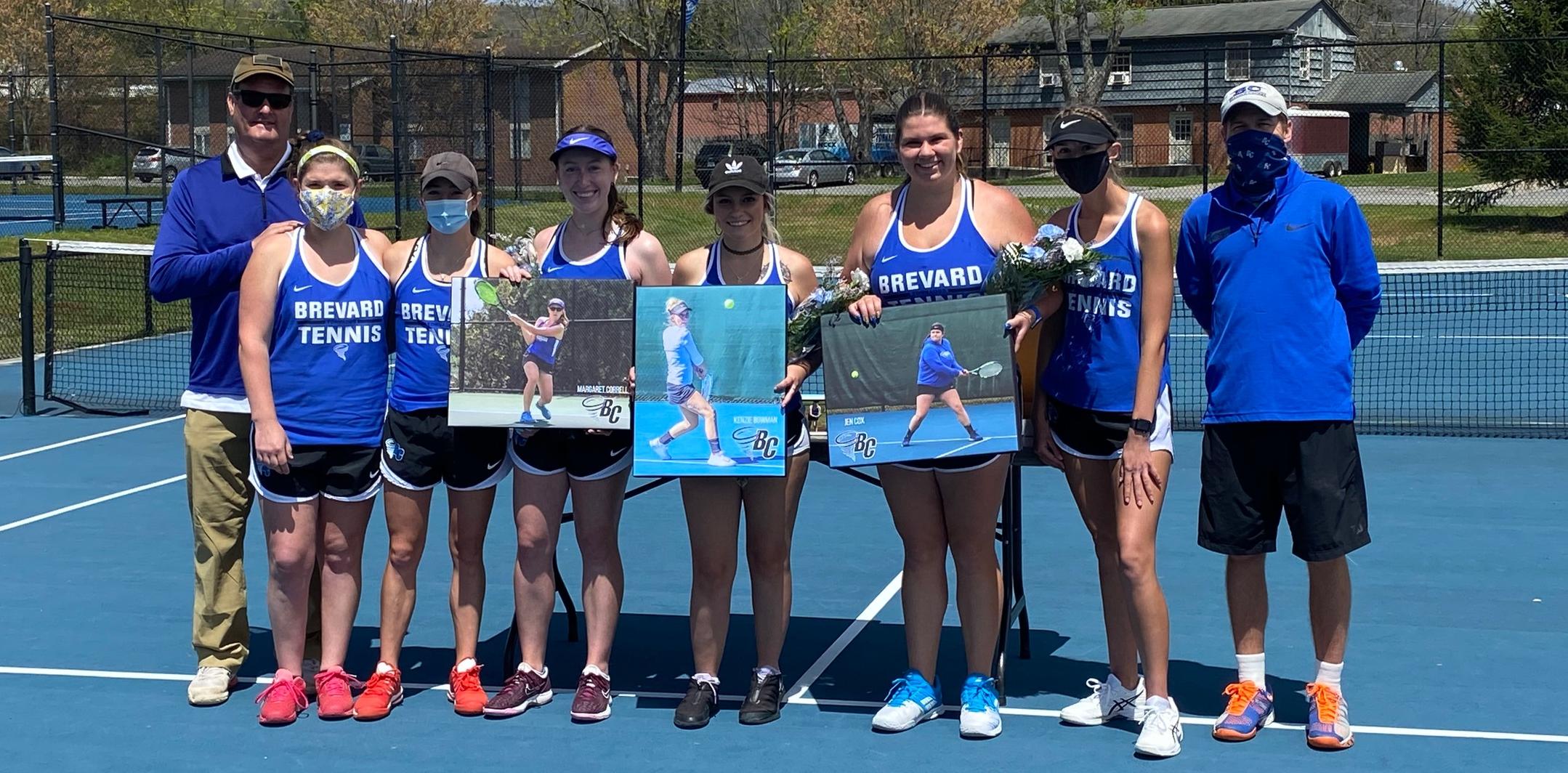 The 2021 Brevard College Women's Tennis senior class (Mekenzie Bowman, Margaret Correll, and Jen Cox) pictured with their teammates and coaches.