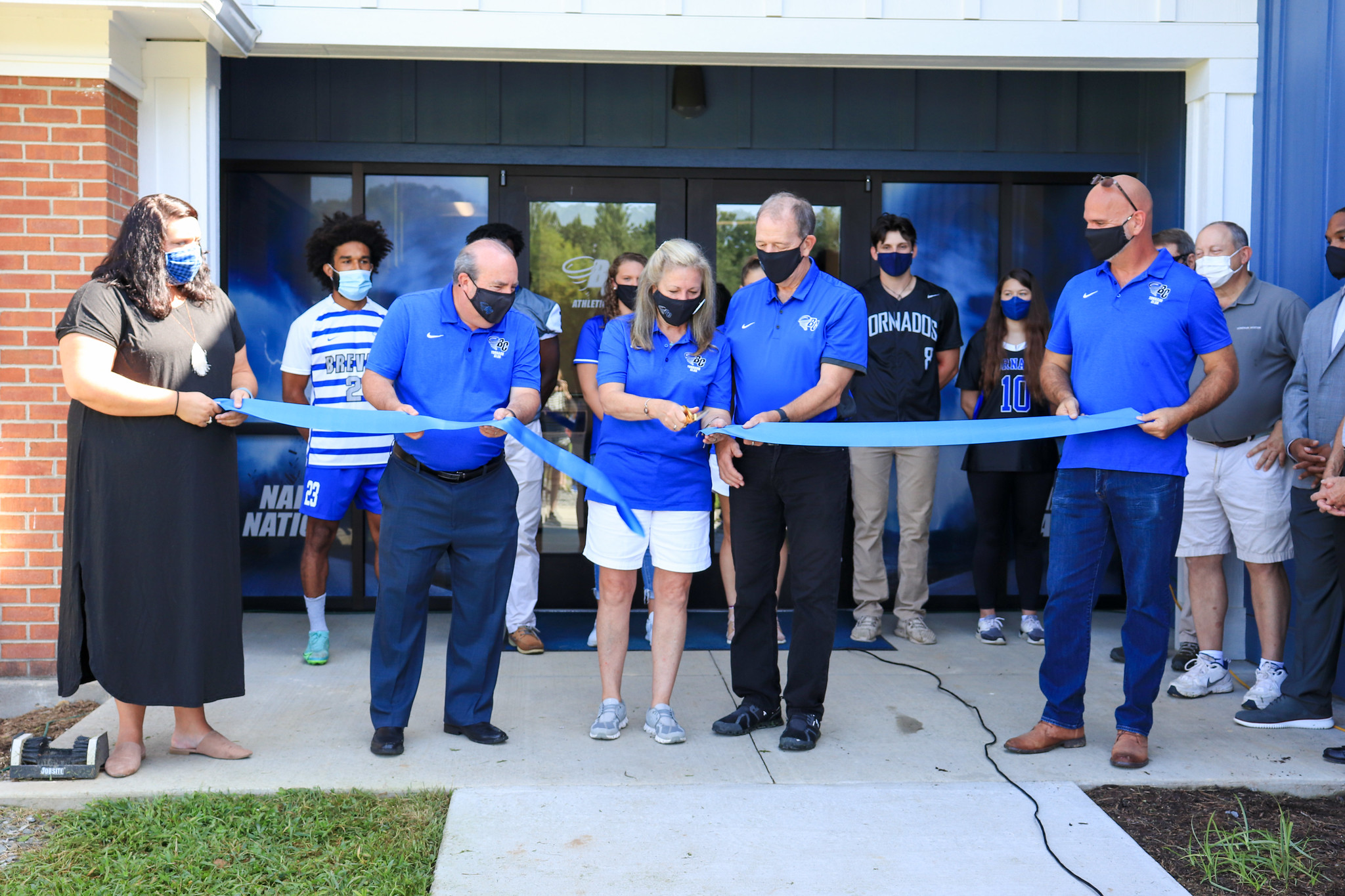 Brevard College President David C. Joyce and Lynne Joyce cut the ceremonial ribbon joined by Vice President for Finance & Operations/CFO and Head Women’s Soccer Coach Juan Mascaro, Director of Athletics and Executive Director of Strategy & Operations Myranda Nash, Director of Facilities Burke Ulrey and student-athletes from six BC sports.