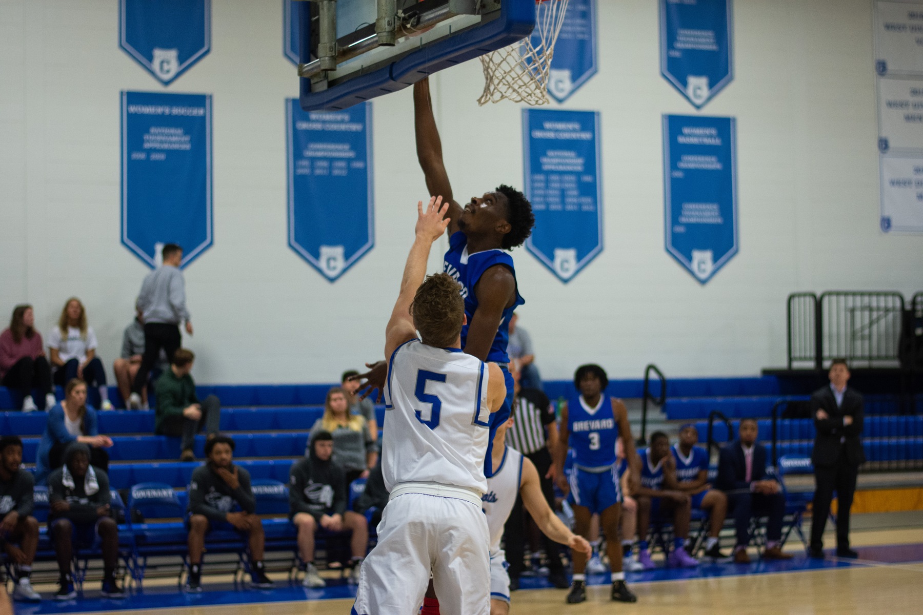 Levi Lamb scoring his 1,000th career point against Covenant earlier this season (Photo courtesy of Nina Grauley - Covenant College)