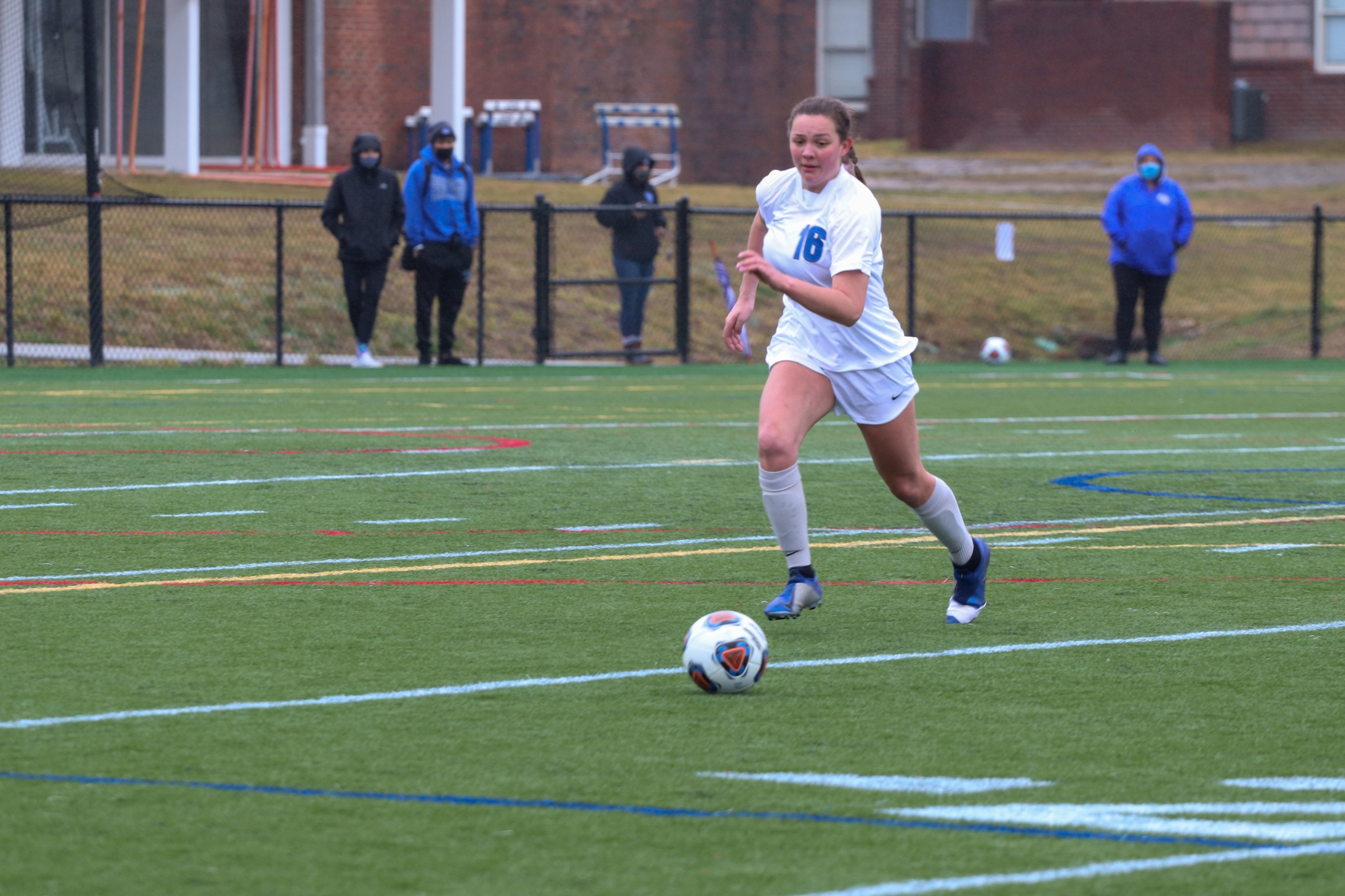 Emma White sprinting for a loose ball (Photo courtesy of Victoria Brayman '22).