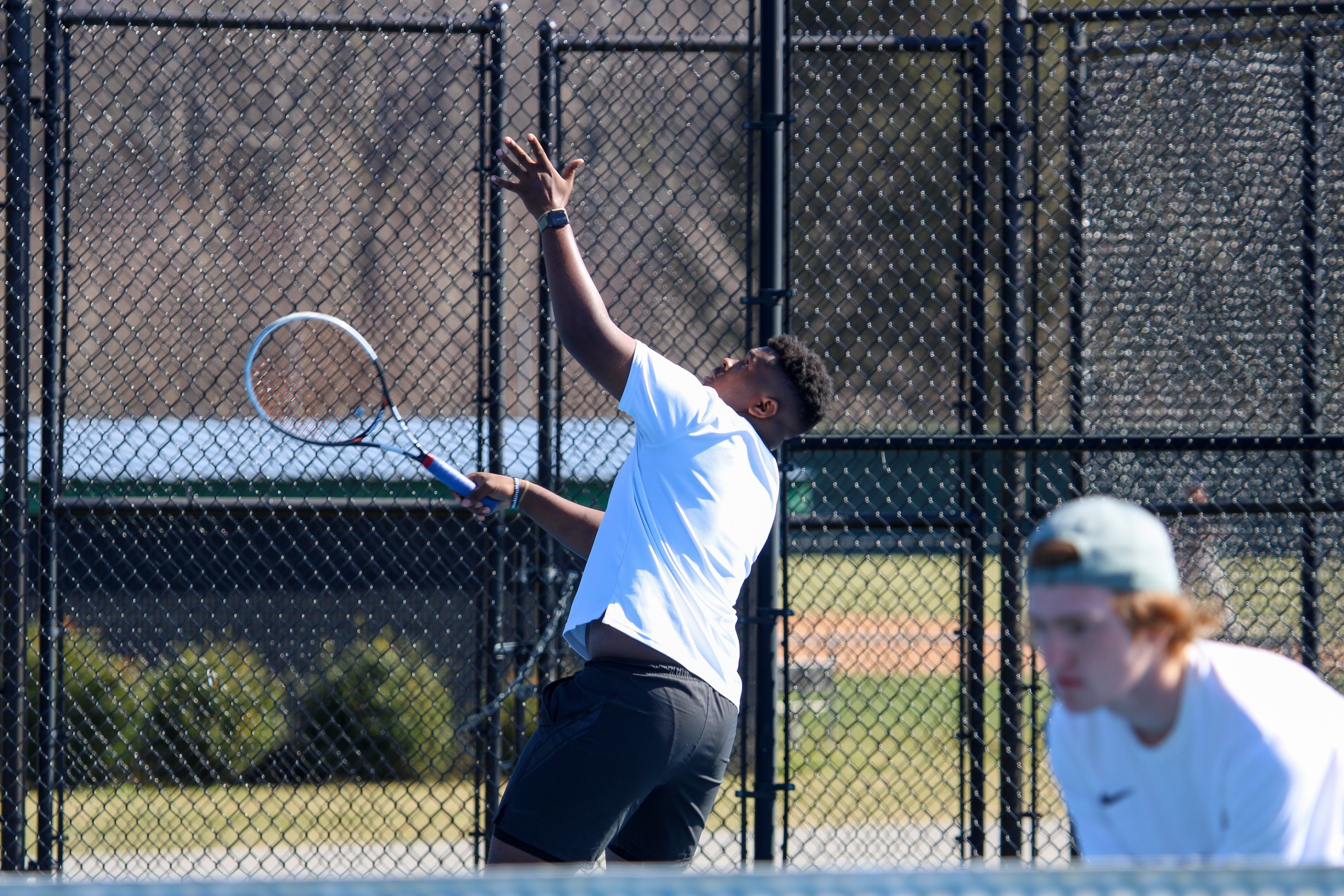 JaMarcus Walker serves up a ball at the McCoy Tennis Complex (Photo courtesy of Brianna Rodibaugh '24).